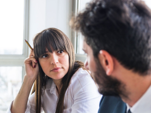 young-businesswoman-looking-male-colleague-office2