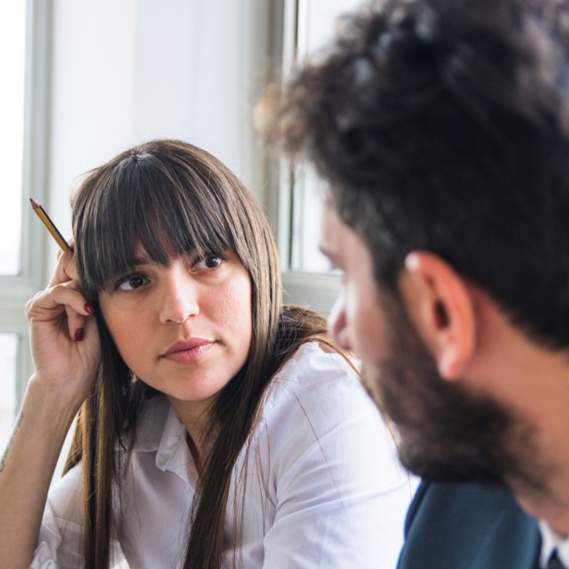 young-businesswoman-looking-male-colleague-office2